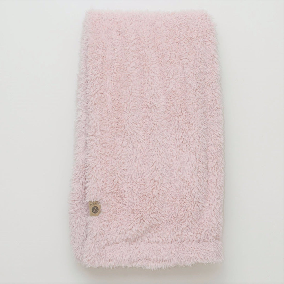 Close up of the Big Guardian Angel blanket in Dusty Pink, with fluffy llama fabric