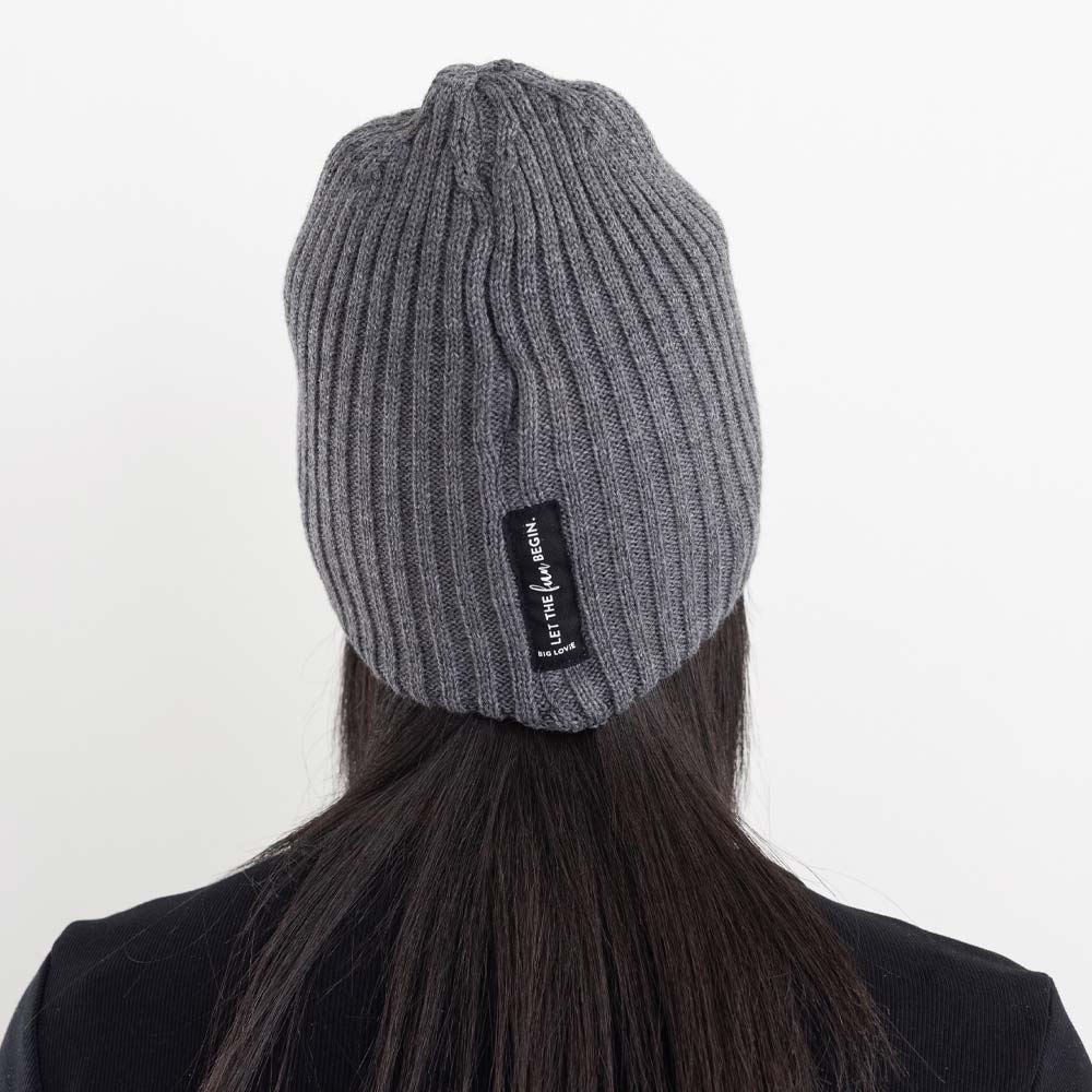 BIG LOViE Let the Fun Begin Gray Beanie, back of hat with message label on woman