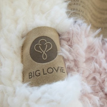 Close up of Love Snap label on a BIG LOViE Guardian Angel Blanket, plush llama fabric 