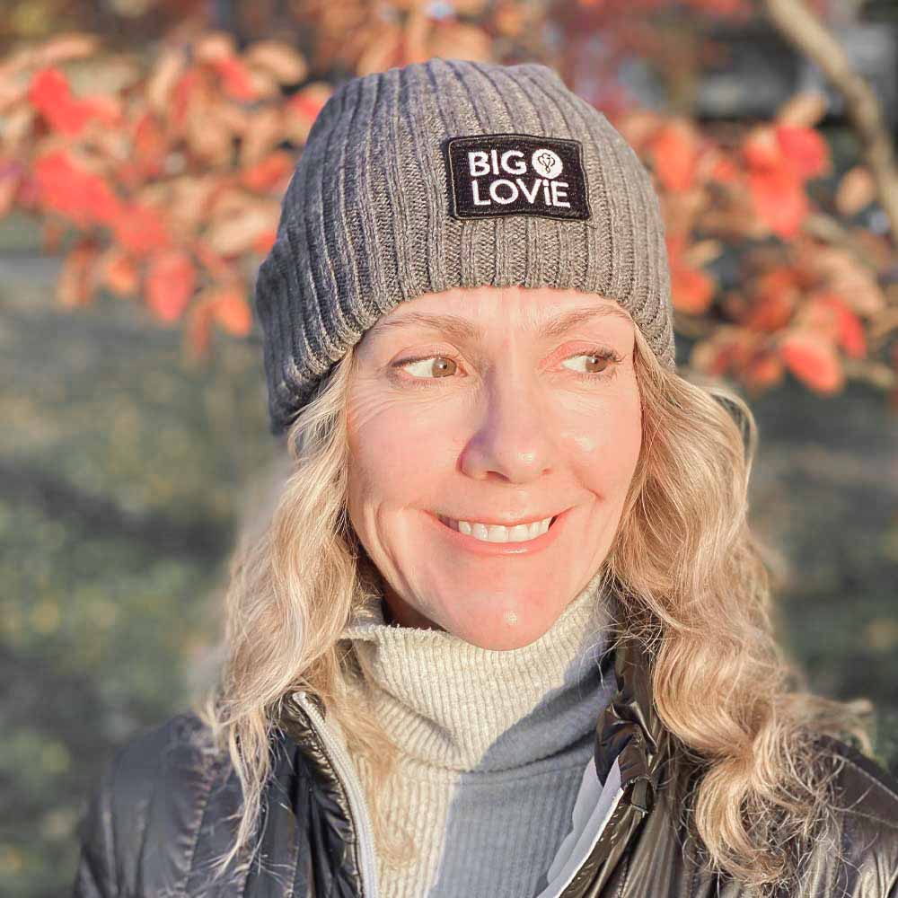 BIG LOViE Let the Fun Begin Gray Beanie front view on smiling woman, autumn day