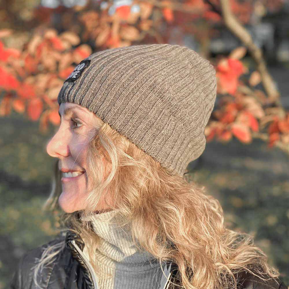 BIG LOViE Let the Fun Begin Gray Beanie side view on smiling woman, autumn day